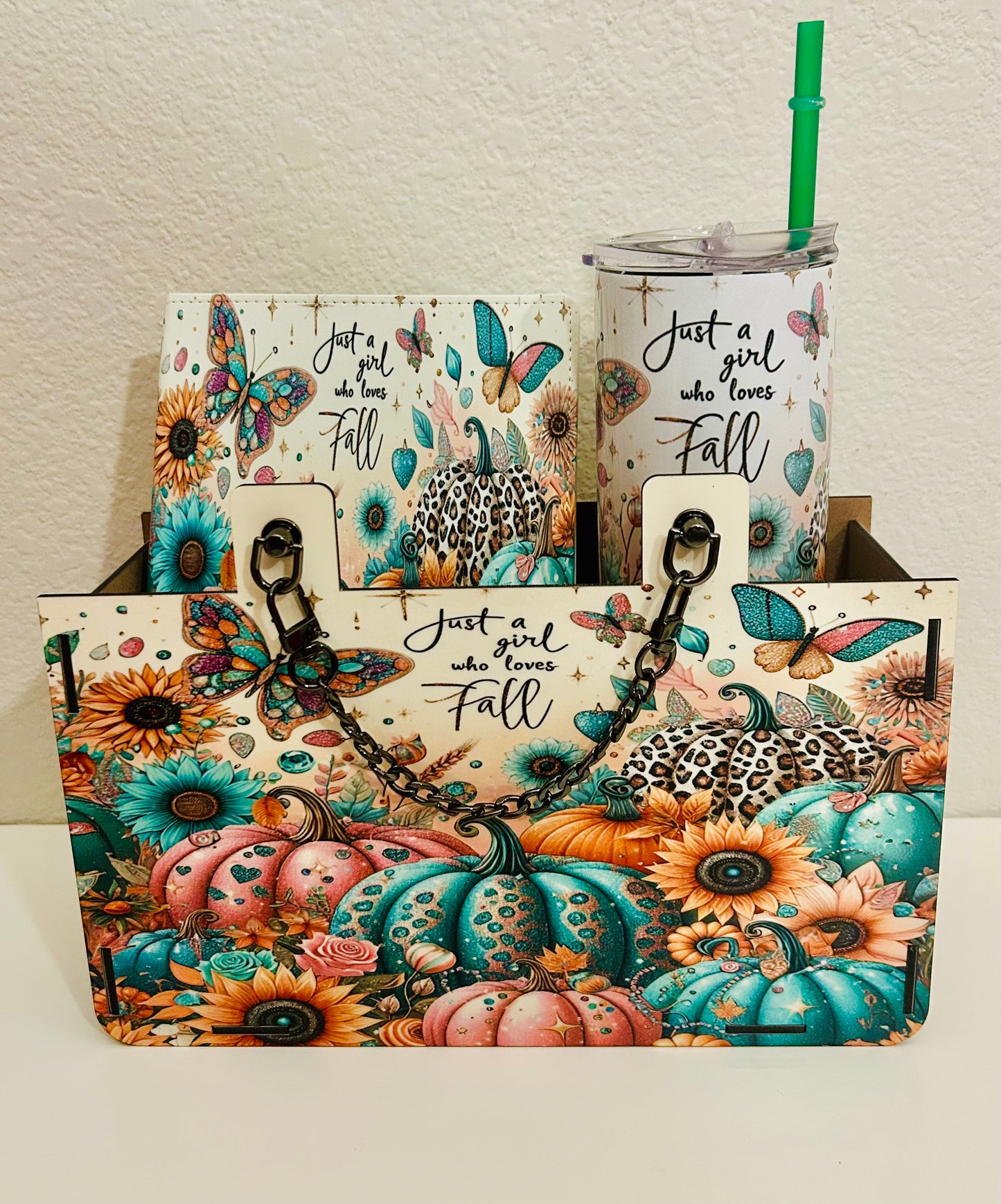 Set of bags and a tumbler with autumn-themed designs and text.